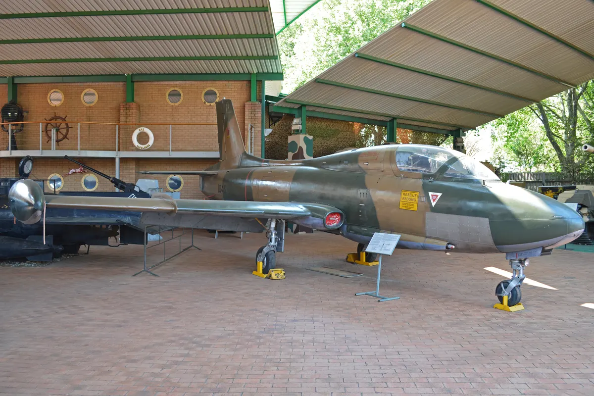 Armed Atlas Impala Mk II on a runway