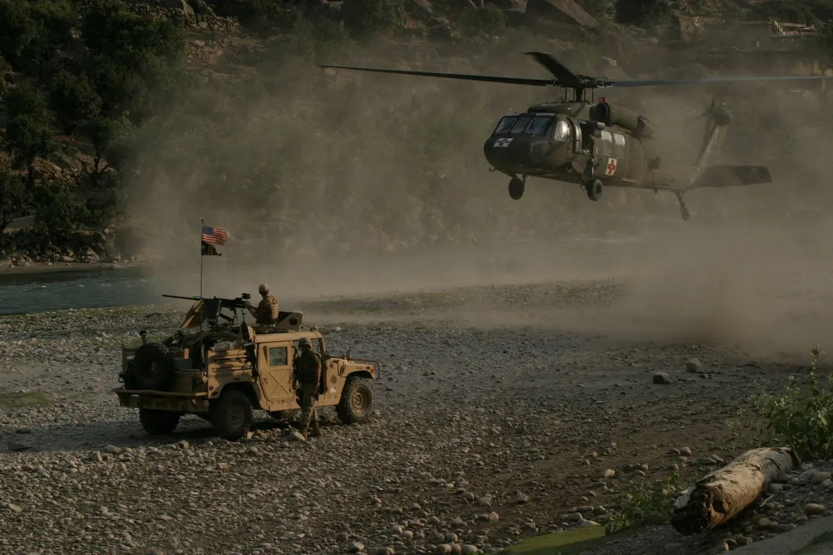US soldier in Afghanistan mountainous terrain