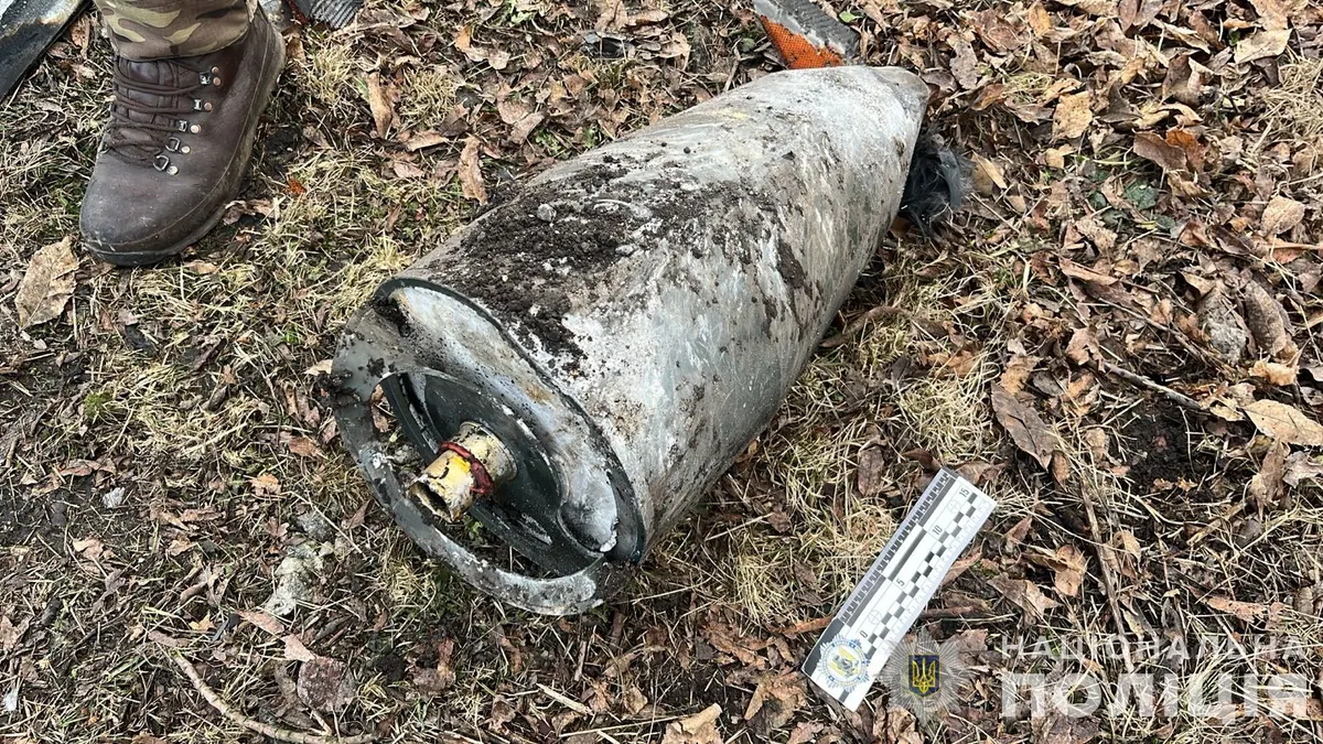Delta-wing loitering munition wreckage lying in a field