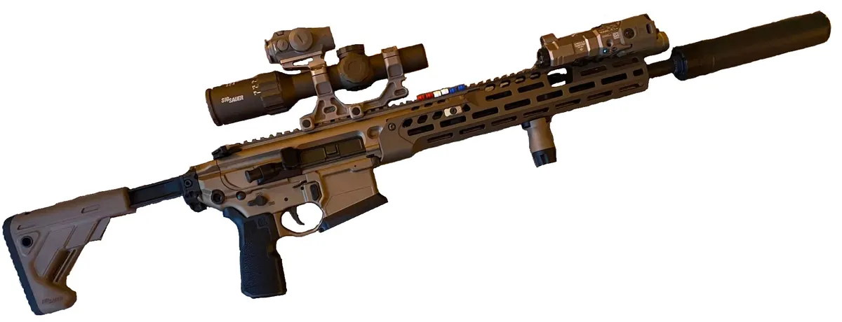 Suppressor mounted on a 6.8mm service rifle barrel