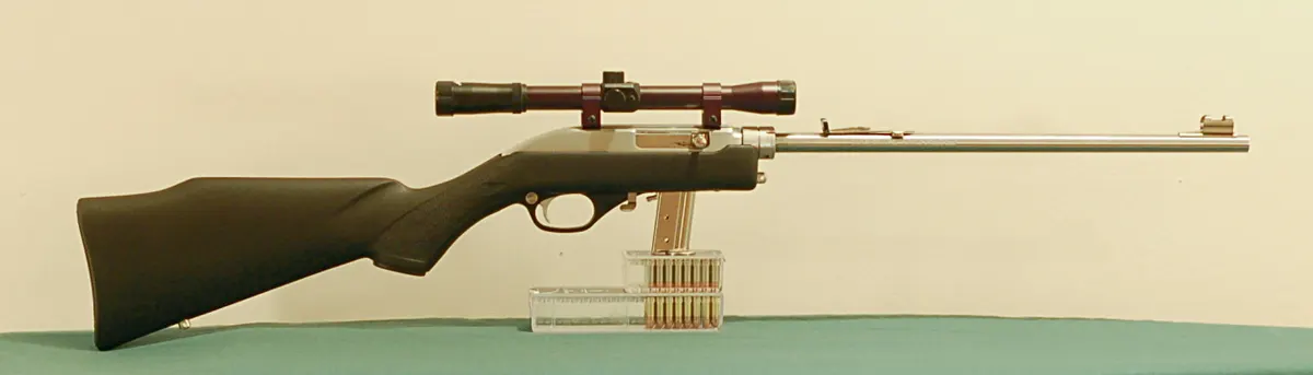 Disassembled Marlin Papoose 70P rifle showing barrel and receiver separated