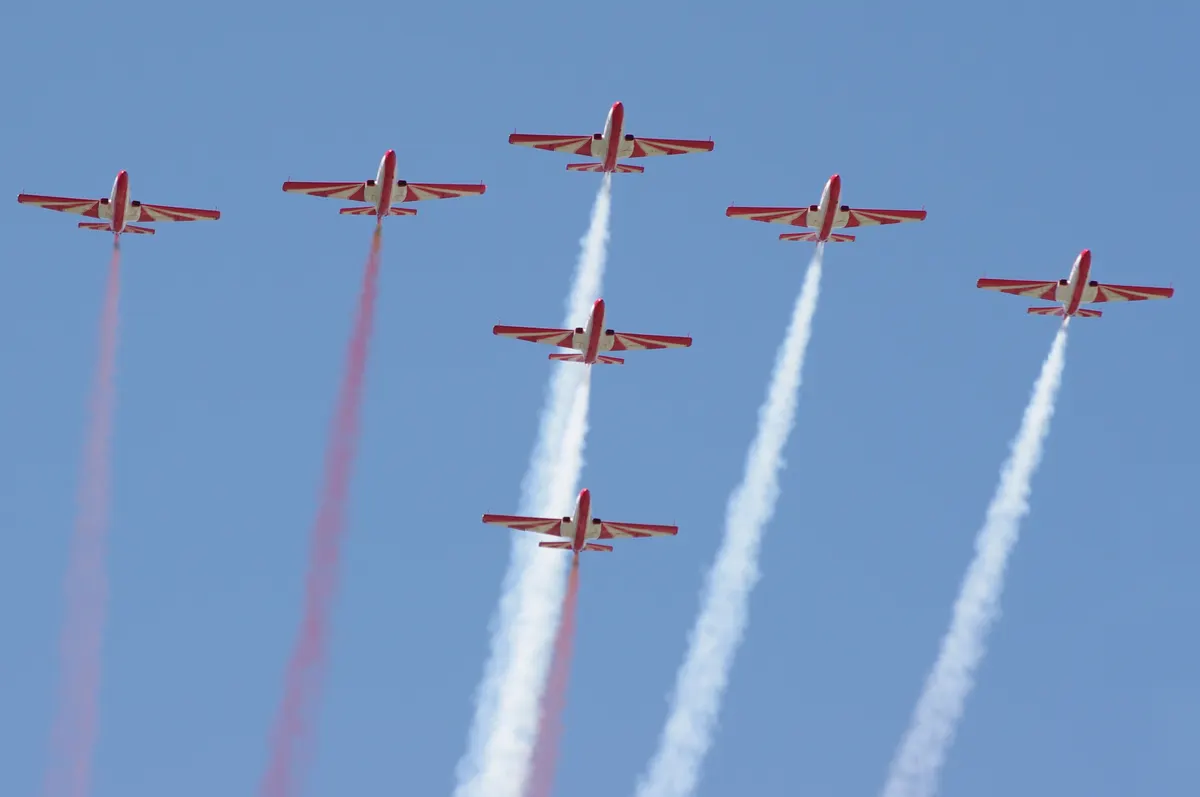 Formation of white and red PZL TS-11 Iskra aerobatic display aircraft