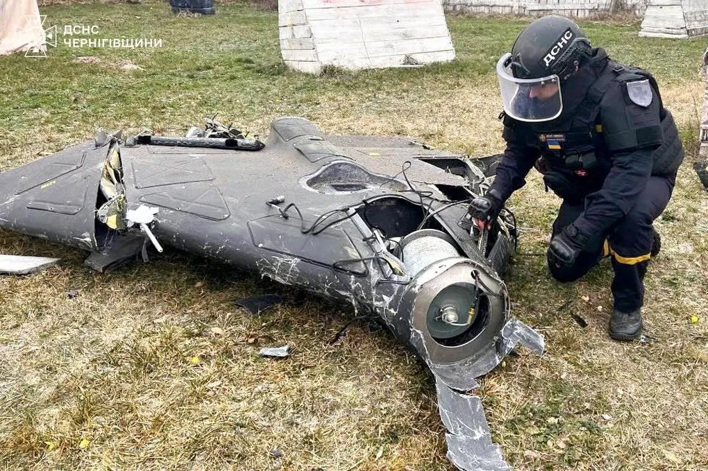 Drone wreckage and engine parts laid out for forensic examination