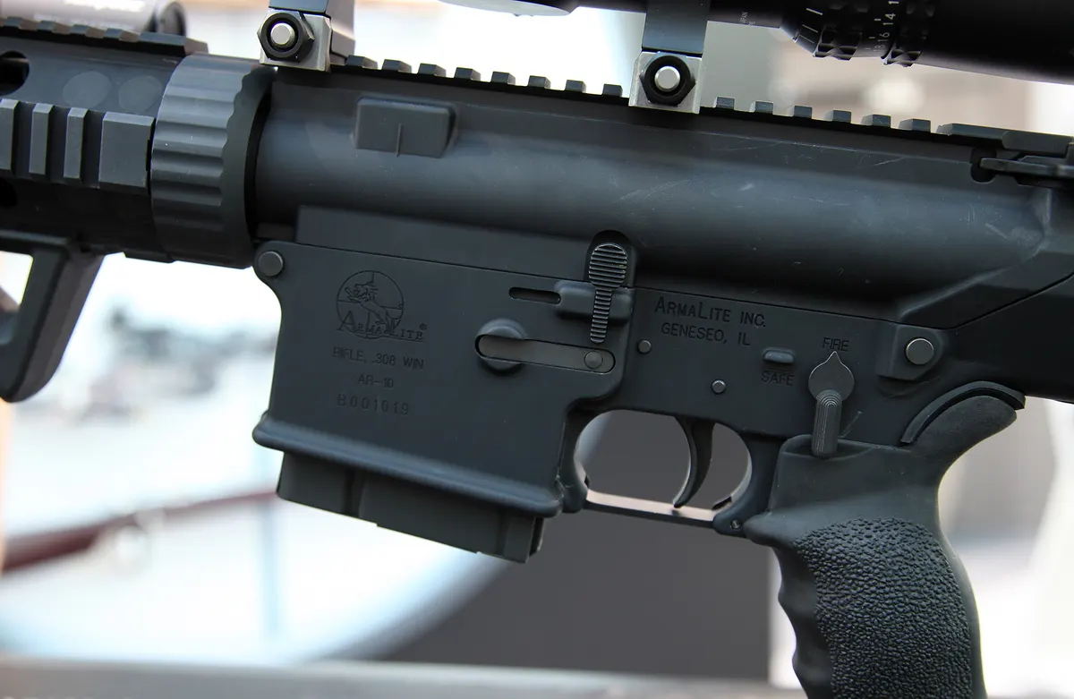 Closeup of AR-10 style rifle upper receiver with Picatinny rail